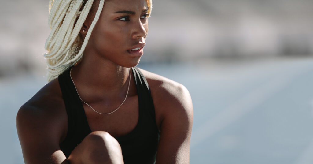 Central Sport woman observing the running track.